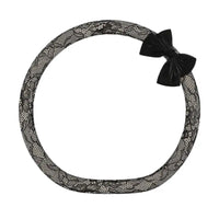 Onyx tweed lace steering wheel cover with black bow knot, D shape flat bottom, alternate angle